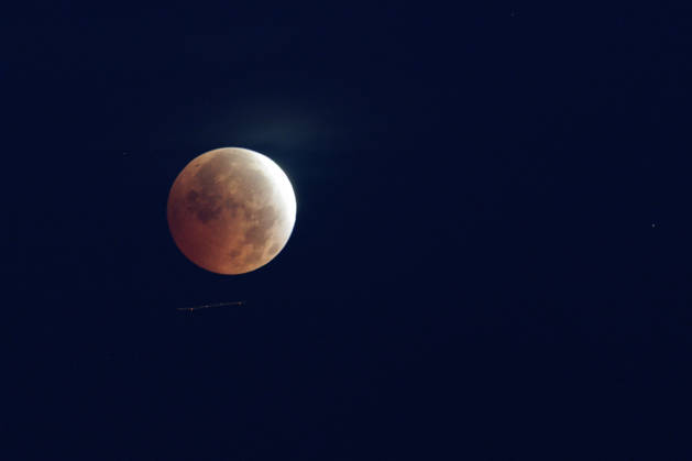 Partial Lunar Eclipse Seen Over Southern France. France - Sete, 28.08.2026 A long time exposure shows an airplane as the Moon appears reddish during a partial lunar eclipse this Friday morning over Sete in southern France. Occitania
