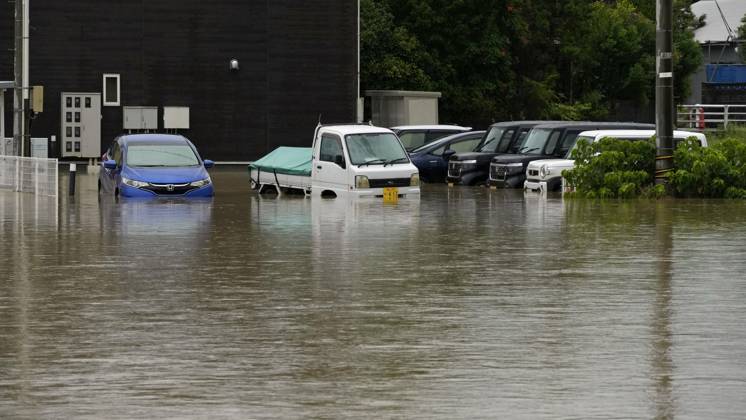 Torrential rain in central Japan Photo taken Aug. 27, 2026, shows submerged vehicles in Himi in Toyama Prefecture, central Japan, following torrential rain.  A14AA0005626701P