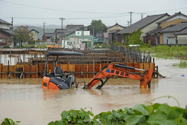 Torrential rain in central Japan Photo taken Aug. 27, 2026, shows submerged heavy equipment in Himi in Toyama Prefecture, central Japan, following torrential rain.  A14AA0005626703P