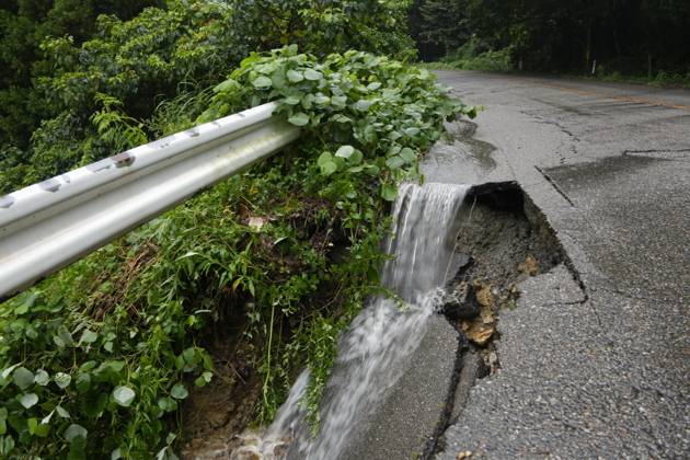 Torrential rain in central Japan Photo taken Aug. 27, 2026, shows a collapsed road in Himi in Toyama Prefecture, central Japan, following torrential rain.  A14AA0005626705P