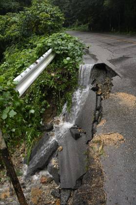 Torrential rain in central Japan Photo taken Aug. 27, 2026, shows a collapsed road in Himi in Toyama Prefecture, central Japan, following torrential rain.  A14AA0005626706P