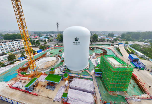 HUAIBEI, CHINA - AUGUST 28: Workers conduct the first air membrane inflation operation at the construction site of the Central Reserve Grain Huaibei Direct Depot air membrane silo project on August 28, 2026 in Huaibei, Anhui Province of China. The facility is reported to be the largest air membrane grain silo group in the country.  Copyright: xVCGx 111662593573