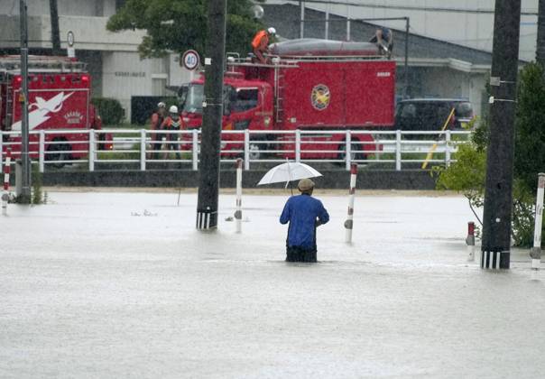 Torrential rain in central Japan A person wades down a submerged street in Himi in Toyama Prefecture, central Japan, on Aug. 28, 2026, following torrential rain.  A14AA0005626748P