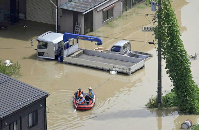 Torrential rain in central Japan Photo taken from a Kyodo News helicopter on Aug. 28, 2026, shows rescuers riding on a boat in a submerged area in Himi in Toyama Prefecture, central Japan, following torrential rain.  A14AA0005626754P