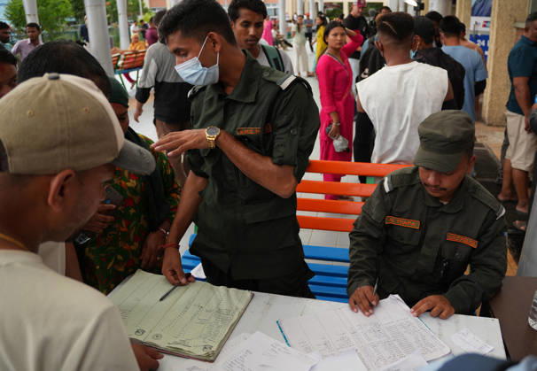 Families Seek Missing Relatives After Devastating Mudslide - Nepal Relatives search through lists of people reported missing after devastating flash floods in Nepal outside Tribhuvan University Teaching Hospital in Kathmandu, Nepal on August 28, 2026. Photo by Sunil Pradhan ABACAPRESS.COM Kathmandu Bagmati Nepal  Copyright: xSuniixPradhan ABACAx