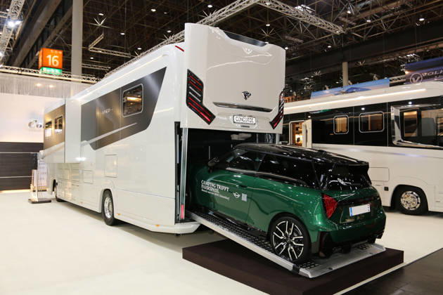 Concorde Liner 1090 GI Atego luxury motorhome with a Mini Cooper SE on the ramp leading to the rear garage, Caravan Salon Düsseldorf, August 28, 2026, Messe Düsseldorf, the world’s leading trade fair for mobile travel, the world’s largest trade fair for motorhomes and caravans, camping and caravaning, mobile vacations, Düsseldorf D