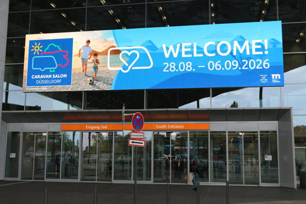 South Entrance with promotional poster on Preview Day at the Caravan Salon Düsseldorf, August 28, 2026, Messe Düsseldorf, the world s leading trade fair for mobile travel, the world s largest trade fair for motorhomes and caravans, camping and caravanning, mobile vacations, Düsseldorf D