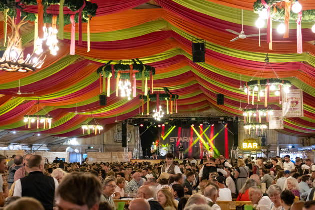 Augsburg, Bavaria, Germany - August 28, 2026: Opening of the Plärrer in Augsburg. A packed festival tent at the Augsburg Herbstplärrer. Numerous visitors celebrate in dirndls and lederhosen, drink beer, and enjoy the lively atmosphere of the traditional folk festival