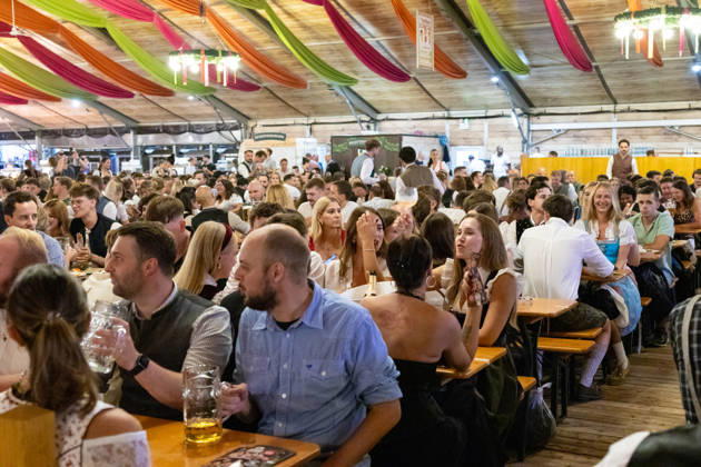 Augsburg, Bavaria, Germany - August 28, 2026: Opening of the Plärrer in Augsburg. A packed festival tent at the Augsburg Herbstplärrer. Numerous visitors celebrate in dirndls and lederhosen, drink beer, and enjoy the lively atmosphere of the traditional folk festival