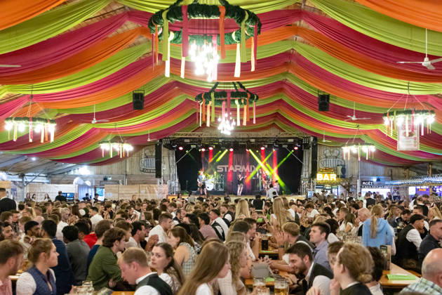 Augsburg, Bavaria, Germany - August 28, 2026: Opening of the Plärrer in Augsburg. A packed festival tent at the Augsburg Herbstplärrer. Numerous visitors celebrate in dirndls and lederhosen, drink beer, and enjoy the lively atmosphere of the traditional folk festival