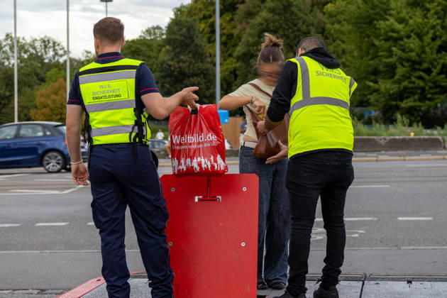 Augsburg, Bavaria, Germany - August 28, 2026: Opening of the Plärrer in Augsburg. A security guard checks a visitor s bag at the entrance to the Augsburg Herbstplärrer. The admission check is intended to ensure the safety of guests at the folk festival