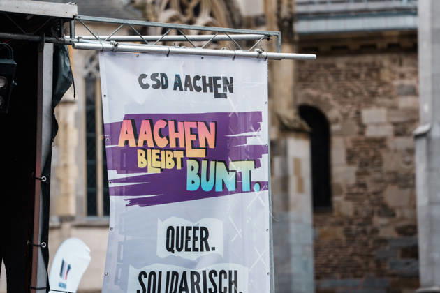 Germany, Aachen CSD, Aachen Pride 2026, Christopher Street Day, parade, equality, anti-queer sentiment, trans rights, equal rights, banners, Aachen Remains Colorful in front of Aachen Cathedral Copyright: xThiemoxRudolphx