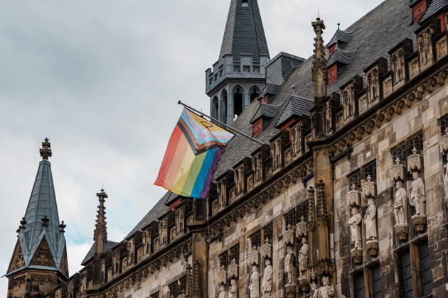 Germany, Aachen CSD, Aachen Pride 2026, Christopher Street Day, Parade, Equality, Anti-queer sentiment, Trans rights, Equal rights, Pride flag flying at Aachen City Hall on the Markt Copyright: xThiemoxRudolphx