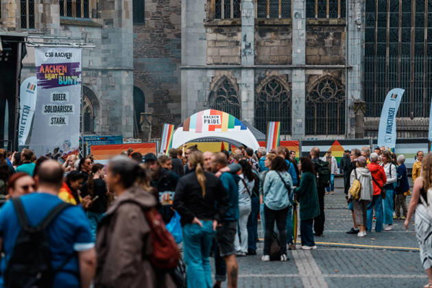Germany, Aachen CSD, Aachen Pride 2026, Christopher Street Day, Parade, Equality, Anti-queer sentiment, Trans rights, Equal rights, Pride flag in front of Aachen Cathedral, Merch Copyright: xThiemoxRudolphx