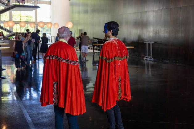 Costume Parade at the Deutsche Oper Berlin, Germany, Berlin, August 29, 2026. With the slogan Unless the People Live Here, the Deutsche Oper Berlin kicked off its new season. Numerous visitors dressed up in costumes from the opera’s wardrobe. Two men wearing masks and red capes in the foyer of the Deutsche Oper Berlin