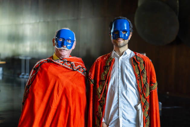 Costume Parade at the Deutsche Oper Berlin, Germany, Berlin, August 29, 2026. With the slogan Unless the People Live Here, the Deutsche Oper Berlin kicked off its new season. Numerous visitors dressed up in costumes from the opera’s wardrobe. Two men wearing masks and red capes in the foyer of the Deutsche Oper Berlin