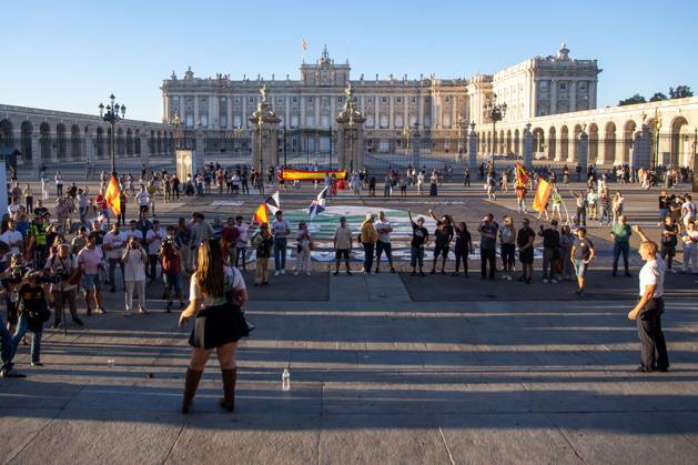 August 29, 2026, Madrid, Spain: A group of protesters gathers around a large banner while listening to a woman give a speech.Rally organized by far-right groups such as Europe Save Act, Revuelta, and Reconquista in support of remigration, under the slogan Save Spain, save Europe! Madrid Spain  - ZUMAs197 20260829_aaa_s197_153 Copyright: xDavidxCanalesx