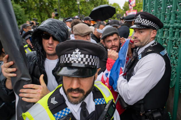 August 29, 2026, London, Westminster, United Kingdom: UKIP supporters and police officers confront one another during the No to Sharia Law march and rally in central London. UKIP leader Nick Tenconi led supporters on a march and rally through central London calling for an end to Sharia law in Great Britain. The demonstration, organized under the banner No to Sharia Law, was met by a counter-protest. Tensions rose at the start of the march, with counter-protesters pushing against police officers as officers attempted to keep the opposing groups apart. The Metropolitan Police had imposed conditions on both demonstrations to prevent serious disorder. London United Kingdom  - ZUMAs197 20260829_aaa_s197_165 Copyright: xJamesxWilloughbyx
