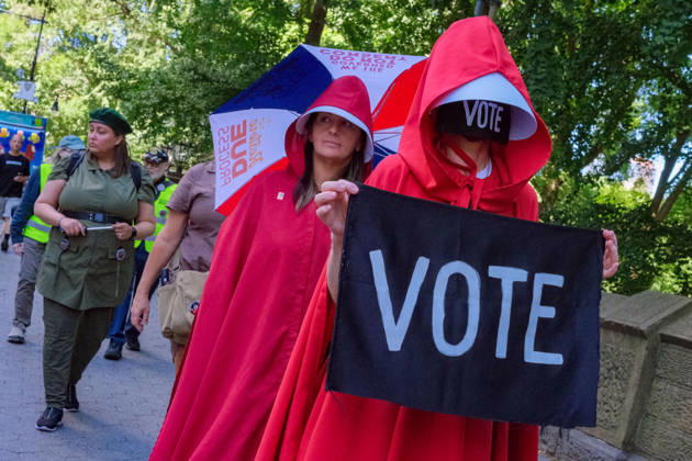 August 29, 2026, New York, New York, USA: Along Central Park the National Handmaiden Army and their visual imagery in NYC silently protesting.Donald Trump, the lack of womens rights, government policies, reproductive rights, getting out the Vote,.gender discrimination and body autonomy. They are striking symbols of political defiance and solidarity. New York USA - ZUMAh156 20260829_znp_h156_003 Copyright: xMiloxHessx