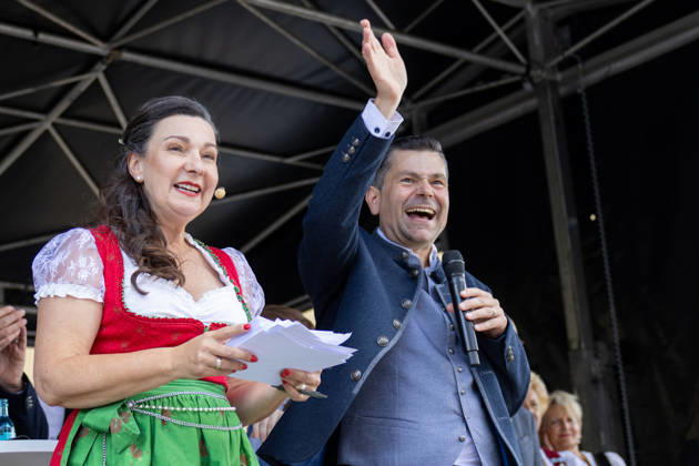 Augsburg, Bavaria, Germany - August 29, 2026: Traditional Plärrer parade in Augsburg. Augsburg s mayor, Dr. Florian Freund (SPD), stands on stage during the traditional Plärrer parade, greets the crowd, and gives a speech to kick off the parade through the city