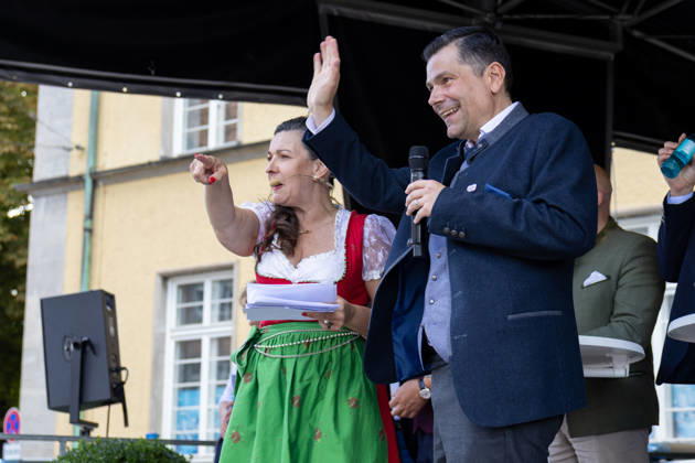 Augsburg, Bavaria, Germany - August 29, 2026: Traditional Plärrer parade in Augsburg. Augsburg s mayor, Dr. Florian Freund (SPD), stands on stage during the traditional Plärrer parade, greets the crowd, and gives a speech to kick off the parade through the city