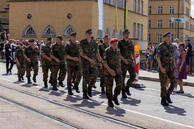 Augsburg, Bavaria, Germany - August 29, 2026: Traditional Plärrer parade in Augsburg. Members of the German Armed Forces and reservists in Flecktarn uniforms take part in the traditional Plärrer parade through Augsburg and march together as a group through the city center