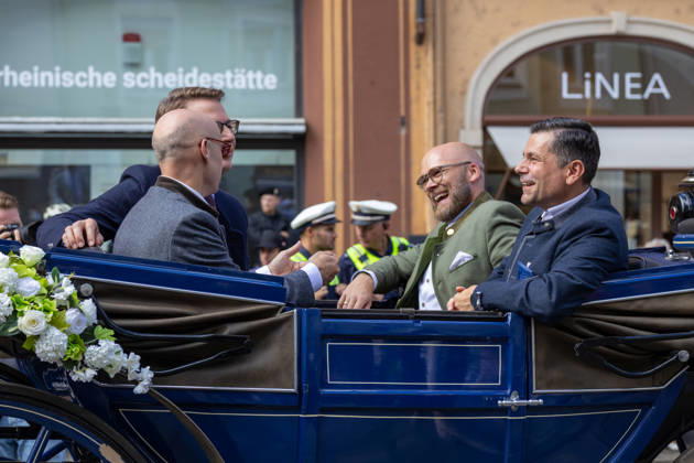 Augsburg, Bavaria, Germany - August 29, 2026: Traditional Plärrer parade in Augsburg. Dr. Fabian Mehring (Free Voters), Markus Blume (CSU), and Augsburg™s mayor, Dr. Florian Freund (SPD), ride together in a carriage through the city center during the traditional Plärrer parade