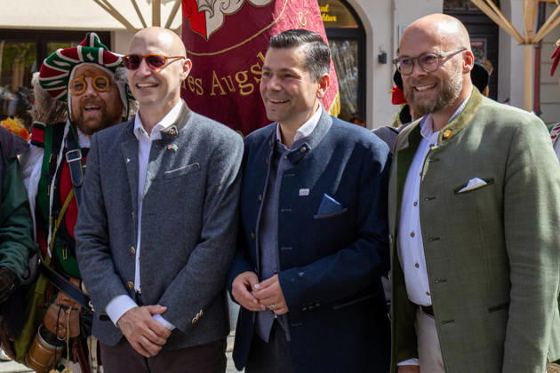 Augsburg, Bavaria, Germany - August 29, 2026: Traditional Plärrer parade in Augsburg. Augsburg Mayor Dr. Florian Freund (SPD) and Bavaria s Minister of Digital Affairs Dr. Fabian Mehring (Free Voters) pose with other participants at the traditional Plärrer parade in Augsburg