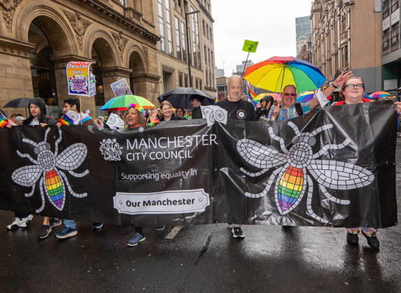 August 29, 2026, Manchester, United Kingdom: Manchester Bee on Manchester Council banner seen during the pride parade. Revelers refused to let a heavy downpour dampen their spirits as the annual parade makes its way through the city centre. Despite the torrential rain, the LGBTQ+ community and supporters partied anyway, filling the streets with vibrant colour, music, and joy. The festival has been officially renamed Manchester Village Pride this year, marking a new community-led chapter after the voluntary liquidation and financial collapse of the former organizing company last autumn. Taking part in the celebrations, the newly elected Mayor of Greater Manchester, Bev Craig, actively engaged with parade participants and cheering crowds alon - ZUMAs197 20260829_aaa_s197_353 Copyright: xGaryxRobertsx