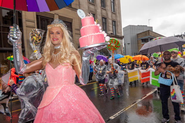 August 29, 2026, Manchester, United Kingdom: Drag queen carries a cake with an umbrella during the pride parade. Revelers refused to let a heavy downpour dampen their spirits as the annual parade makes its way through the city centre. Despite the torrential rain, the LGBTQ+ community and supporters partied anyway, filling the streets with vibrant colour, music, and joy. The festival has been officially renamed Manchester Village Pride this year, marking a new community-led chapter after the voluntary liquidation and financial collapse of the former organizing company last autumn. Taking part in the celebrations, the newly elected Mayor of Greater Manchester, Bev Craig, actively engaged with parade participants and cheering crowds along the - ZUMAs197 20260829_aaa_s197_373 Copyright: xGaryxRobertsx