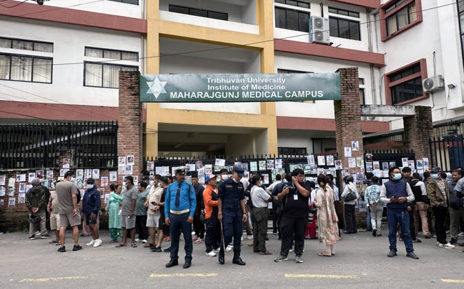 August 30, 2026, Kathmandu, Nepal: Family members gather outside a hospital to check photographs of missing people as they await information about their loved ones at Tribhuvan University Teaching Hospital in Maharajgunj, Kathmandu,Nepal on August 30, 2026. Recovered bodies are being kept at the hospital for identification and post-mortem examinations following the devastating floods in Rasuwa.According to authorities, 734 people had died and 2,498 remained missing as morning of Aug. 30, 2026, following devastating flash floods that struck areas near the Nepal-China border on Aug. 26. Kathmandu Nepal - ZUMAs233 20260830_zap_s233_004 Copyright: xSunilxSharmax