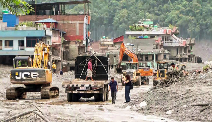 RECORD DATE NOT STATED Heavy Machinery Clears Mud and Debris from Flood-Damaged Residential Area in Nuwakot Nuwakot Nepal , Aug 30 (ANI): Heavy machinery, including excavators and trucks, clears thick mud and debris from a residential area damaged by a devastating flood, as people assess the site amid ongoing cleanup operations at Trishuli, in Nuwakot on Sunday. (ANI Video Grab) Nuwakot Nepal Copyright: xANIx ANI_20260830155