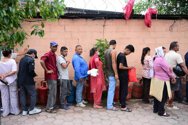 August 31, 2026, Kathmandu, Bagmati, Nepal: Customers wait in long queues to receive liquefied petroleum gas (LPG) cylinders in Kathmandu, Nepal, on August 31, 2026, as the devastating Rasuwa floods add further pressure to an already strained cooking gas distribution system. Nepal had already been facing long queues and difficulties obtaining LPG, with increased demand and distribution problems affecting consumers. The catastrophic flash floods that struck near the Nepal-China border on August 26 swept away homes, vehicles, roads, bridges and other infrastructure, while LPG cylinders were also carried away by the powerful floodwaters. Some people were seen entering the floodwaters and swimming to retrieve the cylinders. The disaster disrupt - ZUMAs330 20260831_zsp_s330_006 Copyright: xSafalxPrakashxShresthax