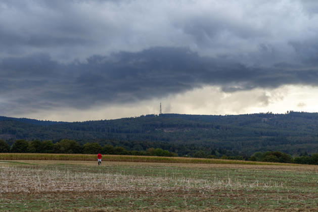 Showery weather in late summer: Dark clouds from a shower are visible in the evening sky over the Taunus Mountains, Oberursel, Hesse, Germany