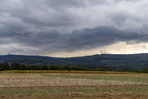 Showery weather in late summer: Dark clouds from a shower are visible in the evening sky over the Taunus Mountains, Oberursel, Hesse, Germany