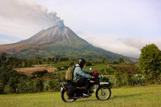 Volcanic activity continues at Mount Sinabung following massive eruption KARO, INDONESIA - SEPTEMBER 1: A man rides his motorbike as volcanic activity continues at Mount Sinabung as it spews volcanic material in Karo Regency, North Sumatra, Indonesia, on September 1, 2026. Following a massive eruption on August 31 that sent a thick column of volcanic ash approximately 3,500 meters (3.5 kilometers) above its summit, the ongoing ashfall and atmospheric disruptions led to the cancellation of 21 flights to and from Kualanamu International Airport. Risky Cahyadi Anadolu Karo Indonesia. Editorial use only. Please get in touch for any other usage.  Copyright: x2026xAnadoluxRiskyxCahyadix
