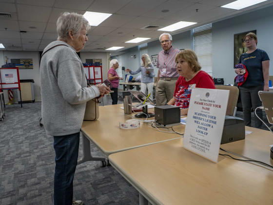September 1, 2026, South Dennis, Massachusetts, USA: An election worker checks in a voter for the Massachusetts primary election. Registered Republicans or Democrats must vote their partys ballot in the primary. Unenrolled voters can vote in either primary. Presenting a drivers license is an option for faster check-in but is not required. South Dennis USA  - ZUMAd155 20260901_znp_d155_007 Copyright: xSuexDorfmanx