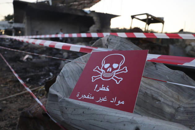 Binnish Syria Ammunition Explosion A warning sign is seen at the site of an explosion in Binnish, Idlib Governorate, Syria, on September 1, 2026. Five people were killed and several others injured when a vehicle loaded with ammunition exploded in Binnish, according to Syrian authorities, while the cause remained unclear and emergency crews worked to secure scattered munitions and prevent further explosions. Binnish Idlib Syria Copyright: xOmarxAlbawx