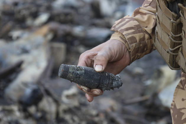Binnish Syria Ammunition Explosion A uniformed man holds an object recovered from debris at the site of an explosion in Binnish, Idlib Governorate, Syria, on September 1, 2026. Five people were killed and several others injured when a vehicle loaded with ammunition exploded in Binnish, according to Syrian authorities, while the cause remained unclear and emergency crews worked to secure scattered munitions and prevent further explosions. Binnish Idlib Syria Copyright: xOmarxAlbawx