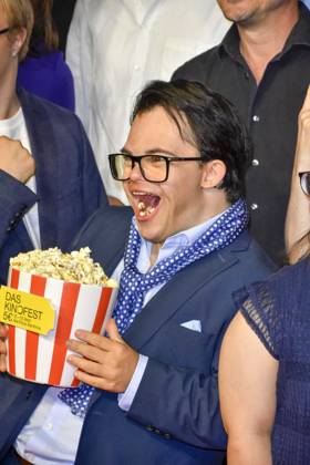 ABB GEWISSEETWAS Frangiskos Kakoulakis Eating Popcorn as a Guest on the Red Carpet at the NRW Kino Film Premiere of *Das gewisse Etwas* at the Cinedom Cinema on September 1, 2026, in Cologne, NRW, Germany