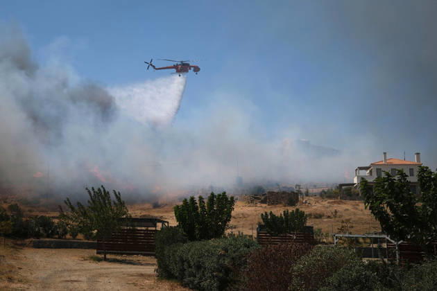 Wildfire near Karystos on Greece s Evia Island EVIA, GREECE - SEPTEMBER 2: A firefighting helicopter drops water, as a wildfire burns near Karystos on the island of Evia, Greece, on September 2, 2026 Costas Baltas Anadolu Evia Greece. Editorial use only. Please get in touch for any other usage.  Copyright: x2026xAnadoluxCostasxBaltasx