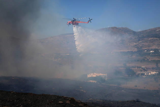 Wildfire near Karystos on Greece s Evia Island EVIA, GREECE - SEPTEMBER 2: Firefighting helicopter drops water, as a wildfire burns near Karystos on the island of Evia, Greece, on September 2, 2026 Costas Baltas Anadolu Evia Greece. Editorial use only. Please get in touch for any other usage.  Copyright: x2026xAnadoluxCostasxBaltasx