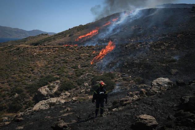 Wildfire burns near Karystos on Greece s Evia island KARYSTOS, GREECE - SEPTEMBER 2: A firefighter stands near flames as a wildfire burns on a hillside near Karystos on the island of Evia, Greece, on September 2, 2026. Costas Baltas Anadolu Karystos Greece. Editorial use only. Please get in touch for any other usage.  Copyright: x2026xAnadoluxCostasxBaltasx