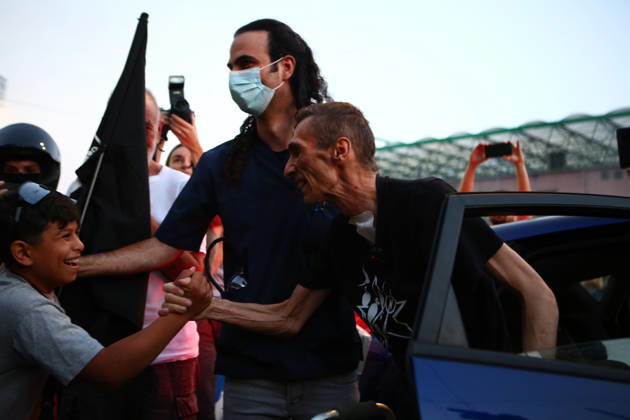 September 2, 2026, Athens, Attica, Greece: Aristotelis Chantzis shakes hands with a young boy as he steps out of a car upon his return to the Prosfygika housing complex in Athens following his release from Evangelismos Hospital. Athens Greece - ZUMAx103 20260902_zip_x103_008 Copyright: xHarrisxXanthopoulosx