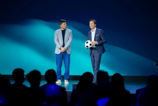 Hisense Press Conference at IFA Germany, Berlin, on September 3, 2026. Hanson Han, CEO of Hisense Europe, and Guillaume Sabran, Chief of Sponsorship and Licensing at UEFA, holding a soccer ball. Hisense is an official sponsor of the 2028 UEFA Euro soccer tournament in the UK and Ireland.