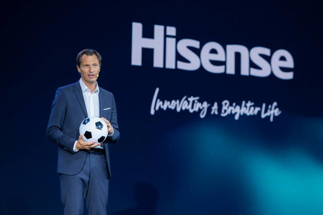 Hisense Press Conference at IFA Germany, Berlin, on September 3, 2026. Guillaume Sabran, Chief of Sponsorship Licensing at UEFA, holding a soccer ball. Hisense is an official sponsor of the 2028 UEFA Euro soccer tournament in the UK and Ireland.