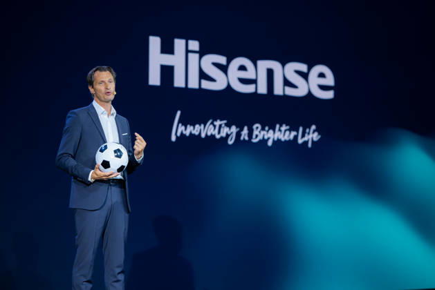 Hisense Press Conference at IFA Germany, Berlin, on September 3, 2026. Guillaume Sabran, Chief of Sponsorship Licensing at UEFA, holding a soccer ball. Hisense is an official sponsor of the 2028 UEFA Euro soccer tournament in the UK and Ireland.