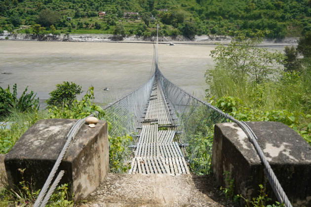 September 4, 2026, Nuwakot, Bagmati, Nepal: A suspension bridge over the Trishuli River damaged by flood originating from the Nepal-Tibet border area. Local residents are facing difficulties due to the damage to this bridge. Nuwakot Nepal  - ZUMAa308 20260904_znp_a308_003 Copyright: xChandraxBahadurxAlex