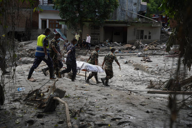 September 4, 2026, Nuwakot, Bagmati, Nepal: Following the devastating floods in Nepal, personnel from the Nepal Army and Nepal Police are carrying body on stretcher through the disaster-affected areas, navigating past flood-damaged houses and debris. Nuwakot Nepal - ZUMAa308 20260904_znp_a308_007 Copyright: xChandraxBahadurxAlex