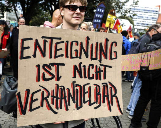 Rent Protest: A protester holding a sign that reads Expropriation is non-negotiable demonstrates against high rents and gentrification and in favor of expropriating housing corporations; thousands of people protested in Berlin on September 5, 2026. Berlin, Berlin, Germany